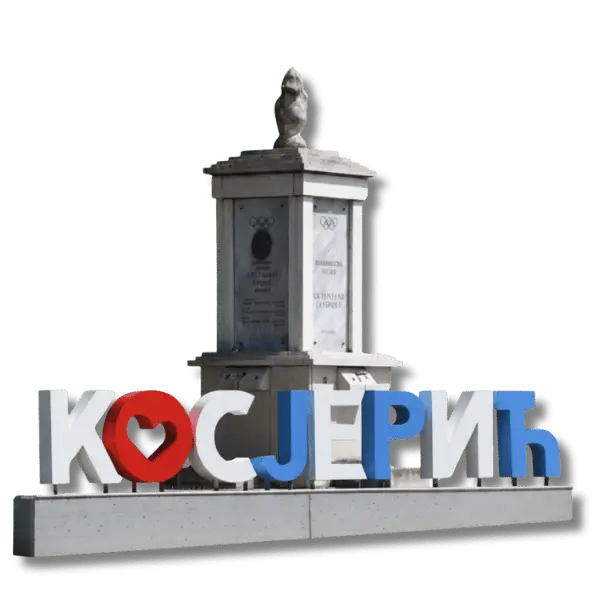 Natpis Косјерић u plavoj, beloj i crvenoj boji ispred spomenika.